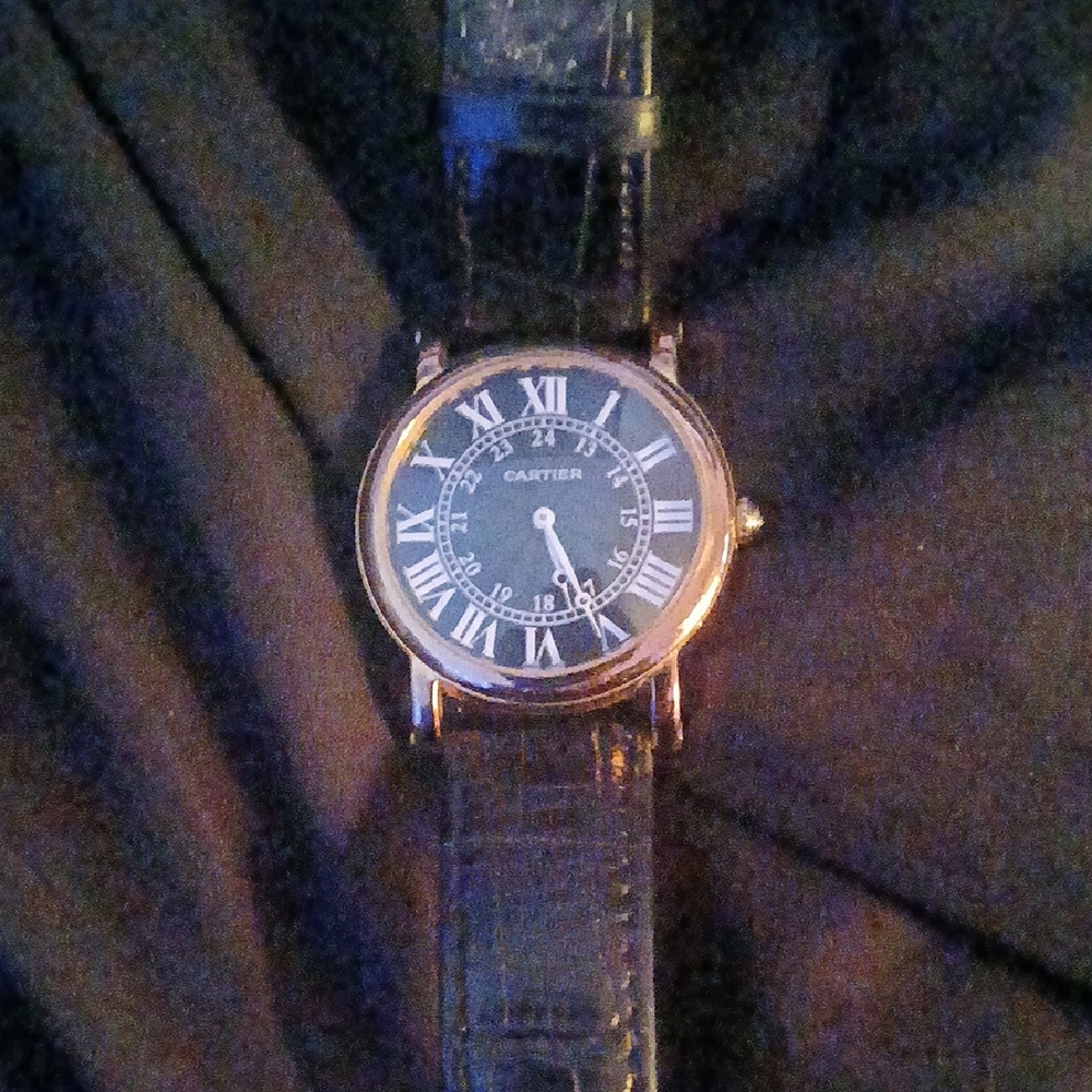 Cartier Black Watch with Elegant Design and Roman Numerals